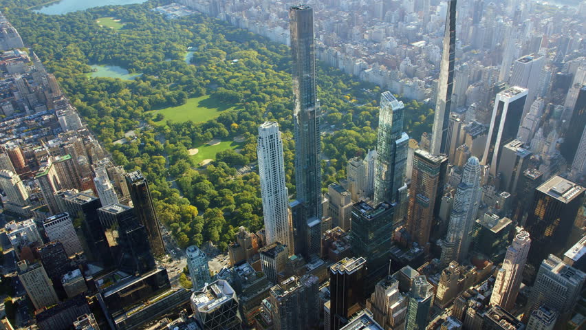 Impressive Dolly Out of Super Tall Skyscrapers and Beautiful Central Park in Midtown Manhattan. Billionaires Row High Quality Content Shot from Helicopter.