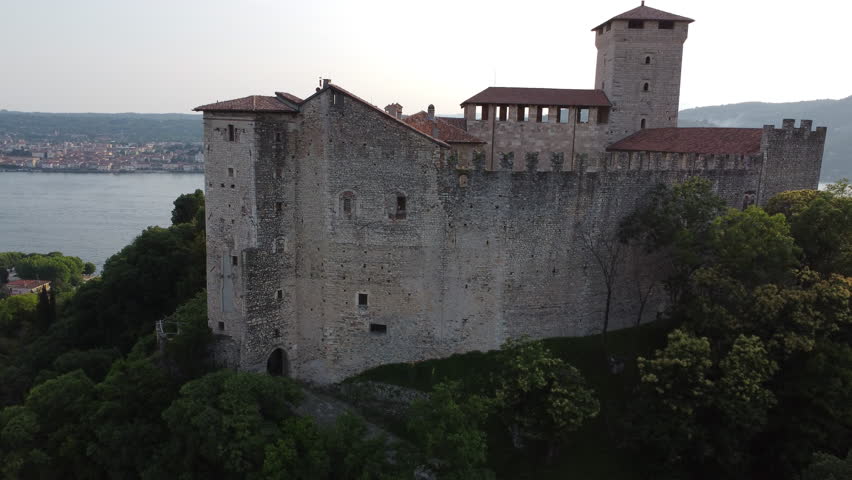 Aerial Shot - Sunset on Rocca Di Angera, Lago Maggiore, Piedmont, Italy. Drone 4k
