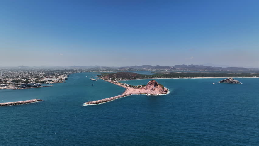 Establishing drone shot of the La Piedra island in sunny Mazatlan, Mexico
