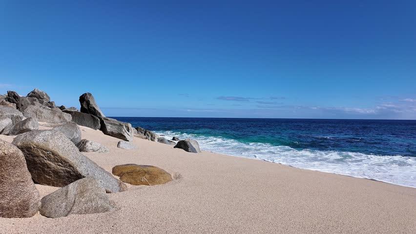 Beach rocks and small waves in Cabo San Lucas Mexico near San José del Cabo.