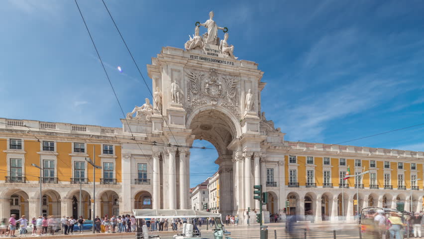 Rua Augusta Arch (Arco da Rua Augusta) timelapse hyperlapse on Praca do Comercio. Historic stone art monument with ornaments and old tourist landmark attraction in Lisbon (Lisboa), Portugal, Europe.