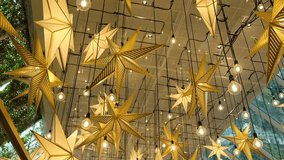 Stars shape lights and bulb light hanging above for Christmas and winter decoration. - Powered by Shutterstock - Get 15% off with code: PIKWIZARD15