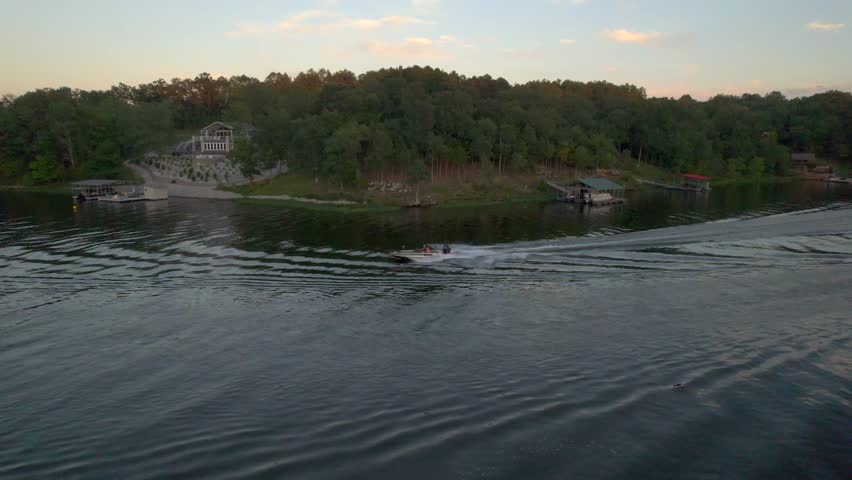 September Labor Day weekend sideways drone footage of a boat at sunset at Lake of Egypt, Southern Illinois