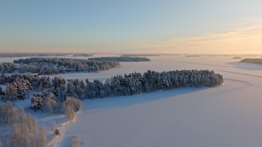 Aerial view overlooking islands on lake Kallavesi, cold, winter morning in Kuopio
