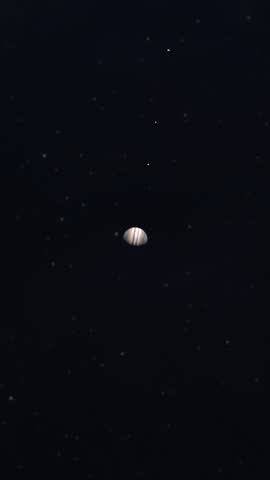 Vertical Timelapse Showing an Accurate Representation of the Galilean Moons Orbiting the Gas Giant of Jupiter