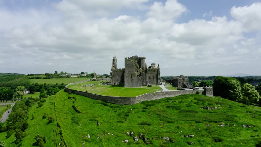 Aerial shot of a castle in Ireland looking out over the surrounding fields.