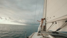 Couple relaxing on private yacht at sunrise. - Powered by Shutterstock - Get 15% off with code: PIKWIZARD15