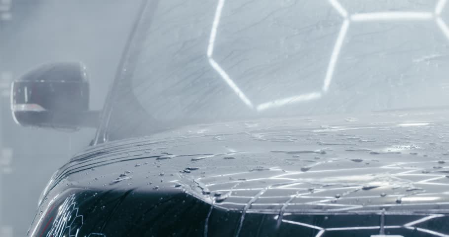 Gentle Car Wash for a Shiny Finish. A gentle yet effective car wash technique is used to maintain the shine of a luxury vehicle. The attention to detail is evident in every step of the process.