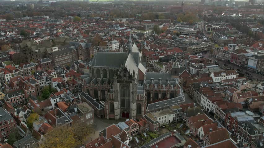 A timelapse drone footage of Hooglandse Kerk church and surrounded buildings in Nieuwstraat, Leiden, South Holland, Netherlands