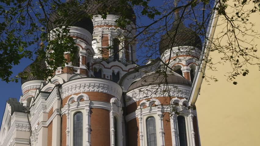 Slow tilt up over facade of orthodox Russian Church in fall