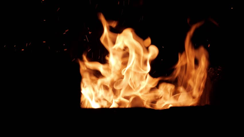 Closeup very birght flames moving quick and violently on the dark.