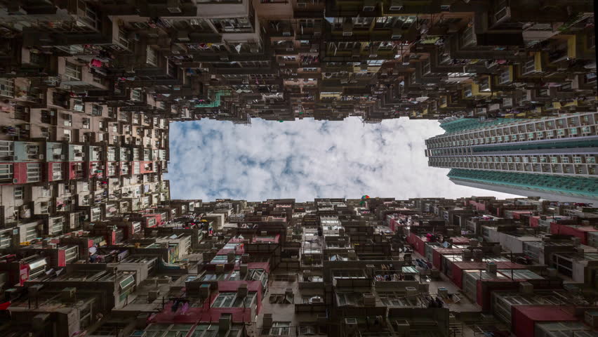 day time famous hong kong city residential apartment building yard exterior up view running clouds 4k timelapse