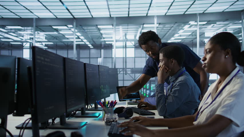Manager supervising server room workers developing disaster recovery plans ensuring minimal downtime. Supervisor oversees data center technicians using data analytics to monitor performance, camera A - Powered by Shutterstock - Get 15% off with code: PIKWIZARD15