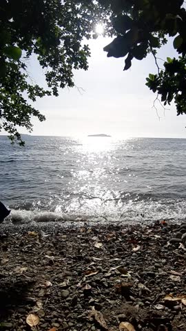 The sound of waves crashing on the beach in the afternoon.