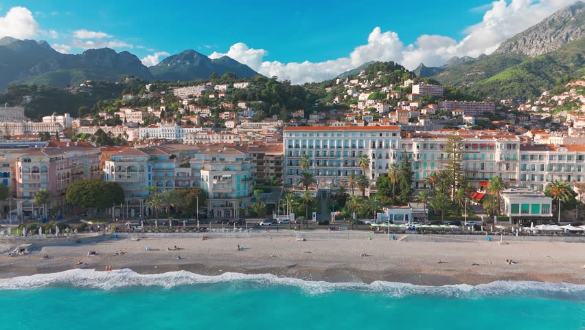 Aerial view of Menton beach on the French Riviera, France. Beautiful Plage du Marche beach in Menton resort town at sunny day. Incredible turquoise sea water of the famouse Cote d'Azur