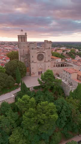Magnificent Cathedral of Saint Nazaire in Beziers at sunrise, Southern France. Aerial view of the Beziers old town in France.