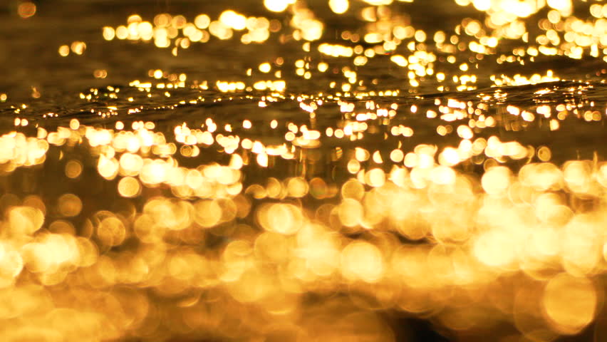 Water, Golden, Reflection - Ripples on a golden surface reflecting light, creating a sparkling effect.