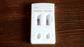 Using Quick Antigen Test Cassette for Covid 19 and Flu. Respiratory Sickness Flu Test Antigen. COVID-19 rapid antigen test. RSV Infection pneumonia or flu cure SARS COV virus test proper diagnosis - Powered by Shutterstock - Get 15% off with code: PIKWIZARD15