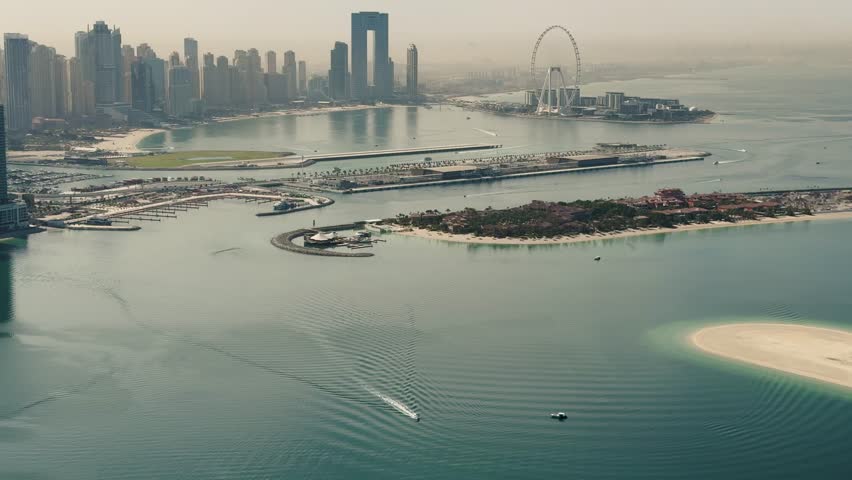 Dubai Marina is a modern and vibrant area, famous for its skyscrapers, scenic waterfront and artificial canal. It includes the giant Ain Dubai Ferris wheel and offers luxury restaurants and shopping.