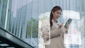 Beautiful asian woman is using an augmented reality smartphone to browse web pages,streaming,apps,search,and social networks.A woman uses her mobile phone while standing down a city street - Powered by Shutterstock - Get 15% off with code: PIKWIZARD15