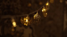 Festive warm lights, house and street decoration. Islamic holiday, Eid Mubarak - Powered by Shutterstock - Get 15% off with code: PIKWIZARD15