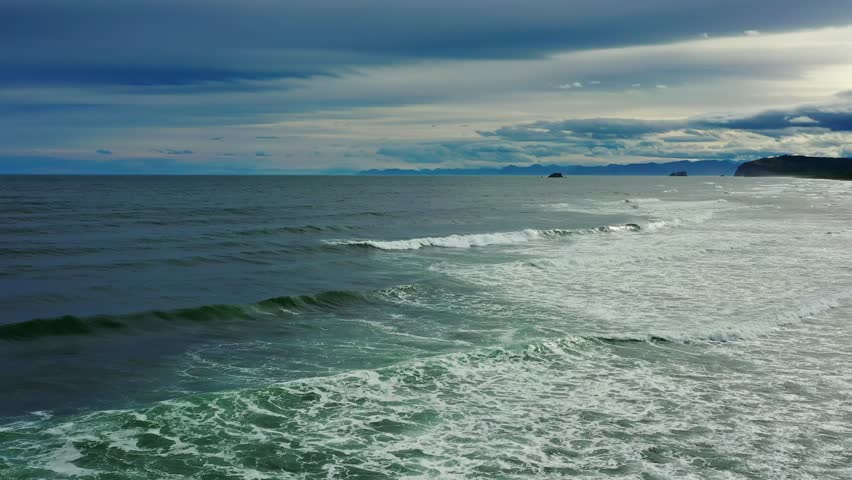 Flying over Khalaktyrsky beach with black sand on Kamchatka peninsula, Russia, Pacific ocean, 4k