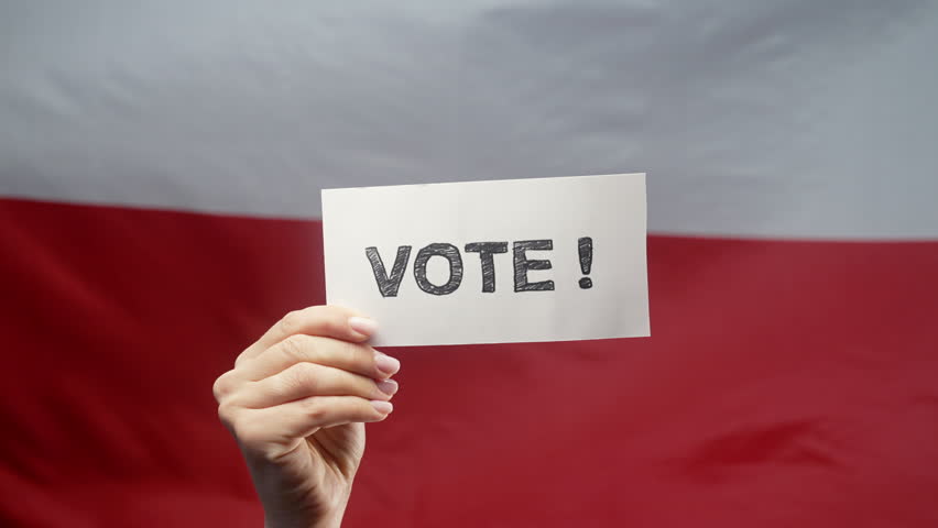Woman Holds Title Sign With Text Vote, Polish Flag Background, General Elections in Poland