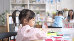 Portrait of children doing learning activities in the classroom - Powered by Shutterstock - Get 15% off with code: PIKWIZARD15