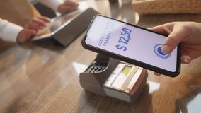 Online payment biometric ID verification system close up. Woman paying for purchase with smartphone and scanning finger print. Electronic money transaction closeup - Powered by Shutterstock - Get 15% off with code: PIKWIZARD15