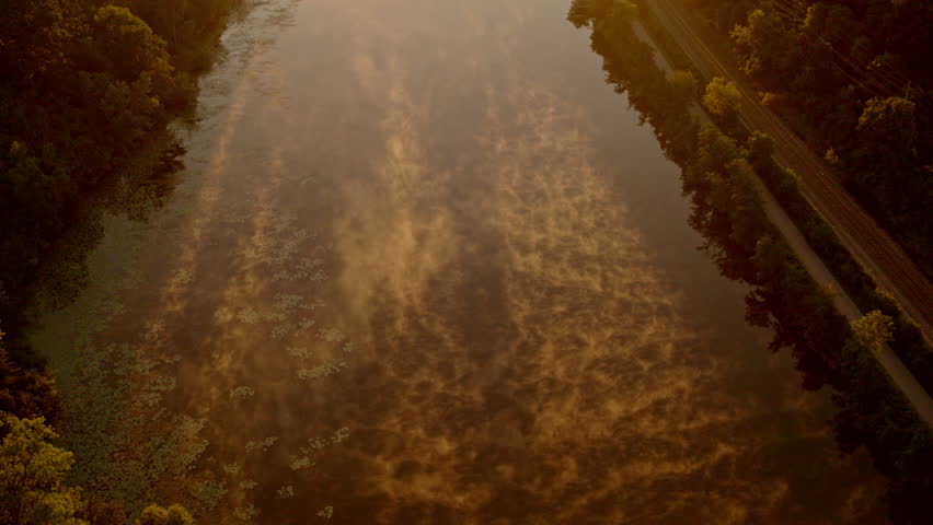 Aerial view of a dramatic foggy summer morning over the Huron River near Ann Arbor, Michigan, captured by a drone.