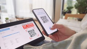 Woman scanning invoice qr code and confirming with fingerprint for online payment. Paying and approving identity with secure biometric technology - Powered by Shutterstock - Get 15% off with code: PIKWIZARD15