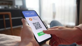 Woman paying with crypto wallet on smartphone close up. Buyer clicking button on mobile screen wile making cryptocurrency payment online closeup - Powered by Shutterstock - Get 15% off with code: PIKWIZARD15