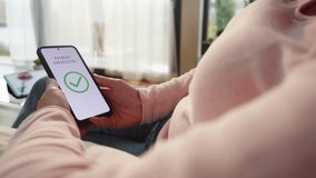 Woman scanning finger print while approving payment on smartphone close up. Buyer paying online using biometric security technology and mobile phone - Powered by Shutterstock - Get 15% off with code: PIKWIZARD15