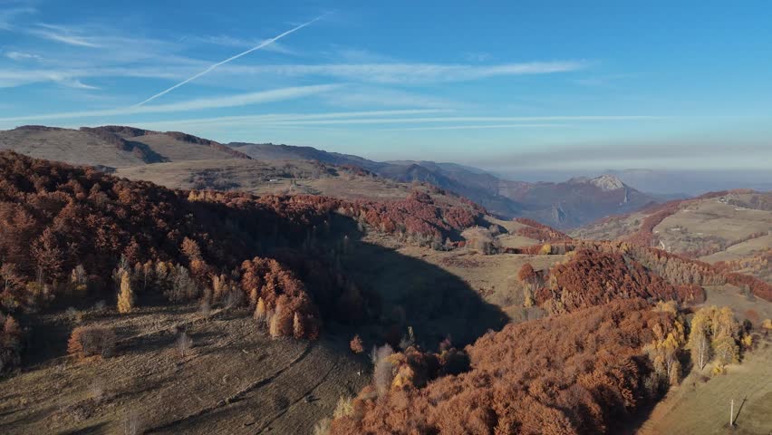 Aerial view of hills in fall during a sunny day.