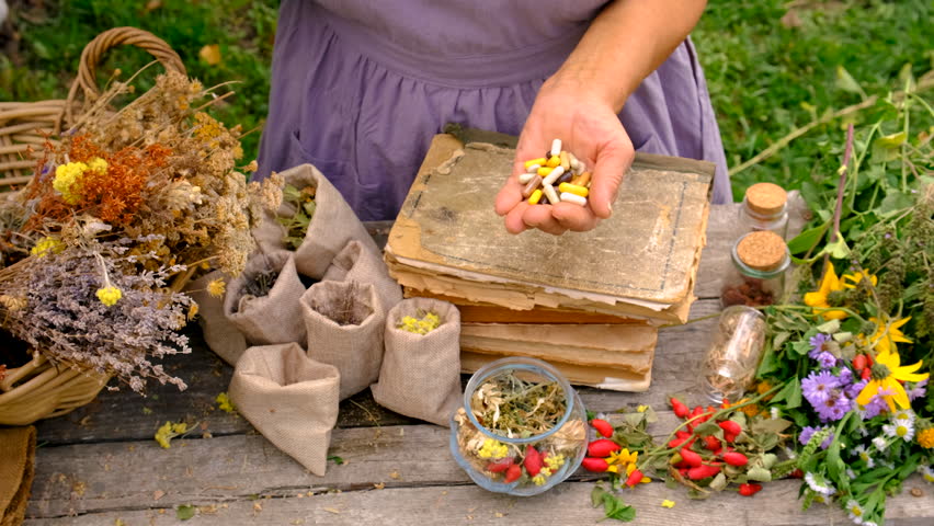 Woman with medicinal herbs. selective focus.