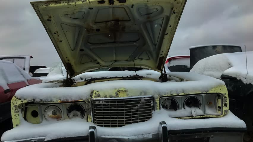 Winter junkyard footage. Rare old car. Unwanted car background. Old cars. Car dump.