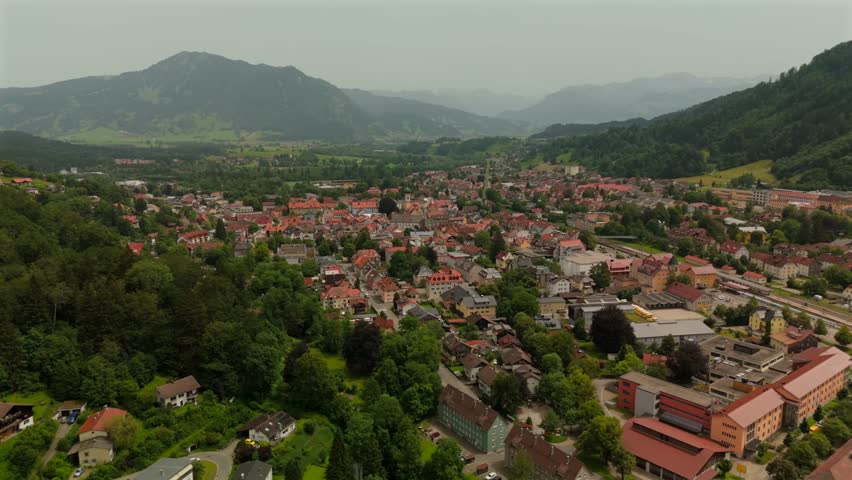 Aerial view of Immenstadt im Allgau, Bayern, Deutschland scenic small town surrounded by Bavarian Alps. Traditional buildings, rolling hills and alpine scenery make destination for summer vacationers
