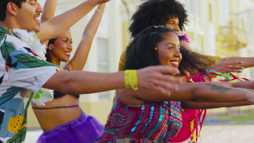 Carnival Revelers Share Dance and Smiles. Brazilian Street Fest Brings Together Vibrant Costumes and Choreography