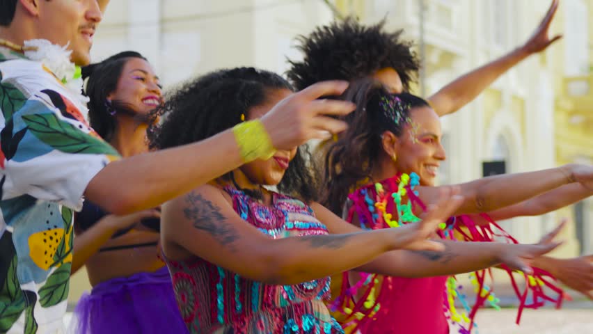 Carnival Revelers Share Dance and Smiles. Brazilian Street Fest Brings Together Vibrant Costumes and Choreography