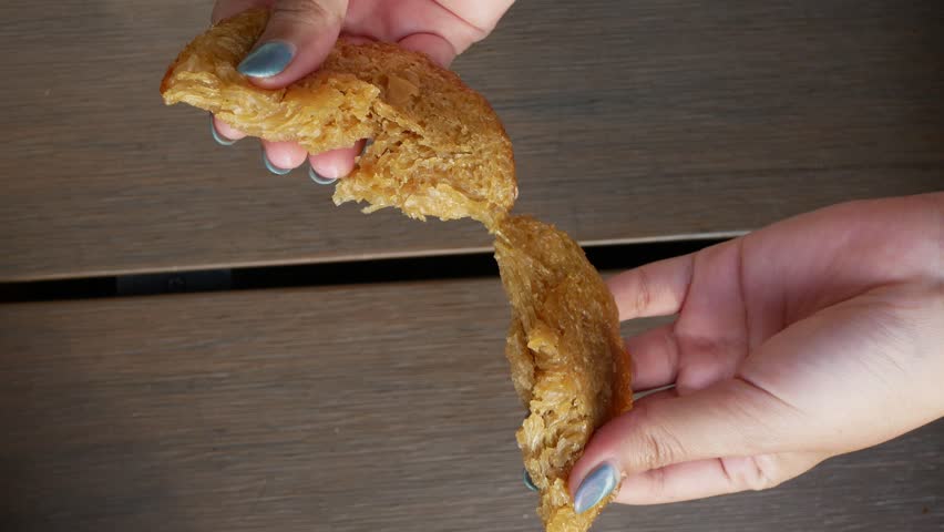 Kue Cucur or bowsprit cake is a typican Indonesian snack food that made from a mixture of rice flour, wheat flour, brown sugar. Vertical Video