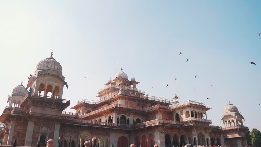 Albert Hall Museum with birds flying in sky at Jaipur, Rajasthan, India. Building exterior. Tourism and holidays concept.