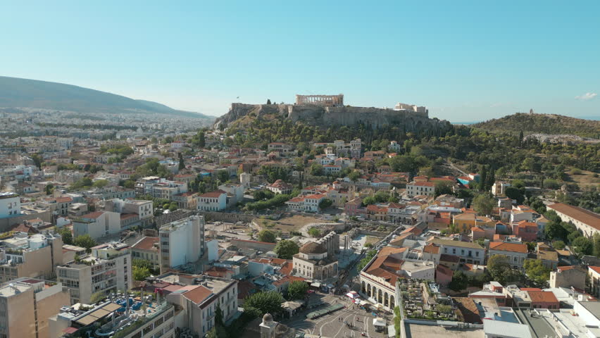 Slow Rise Above Monastiraki District In Athens Greece With Acropolis And Sea Beyond 4K 60FPS