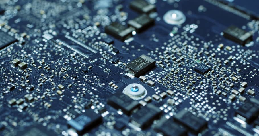 Detailed view of a sophisticated circuit board, showcasing intricate microchip designs and connections