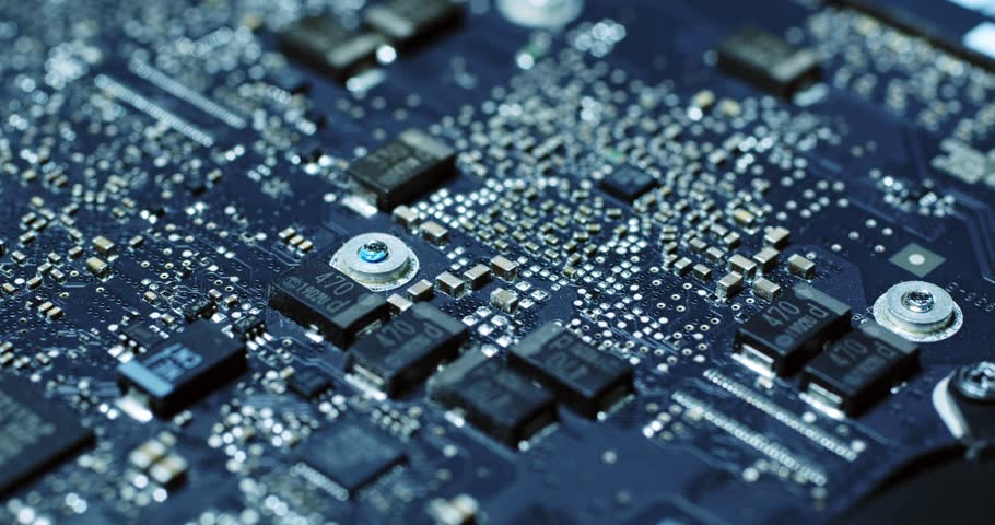 Detailed view of a sophisticated circuit board, showcasing intricate microchip designs and connections