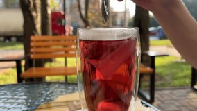 stir sugar in a glass Drinking tea and stirring it with sugar. Glass of Turkish tea. - Powered by Shutterstock - Get 15% off with code: PIKWIZARD15