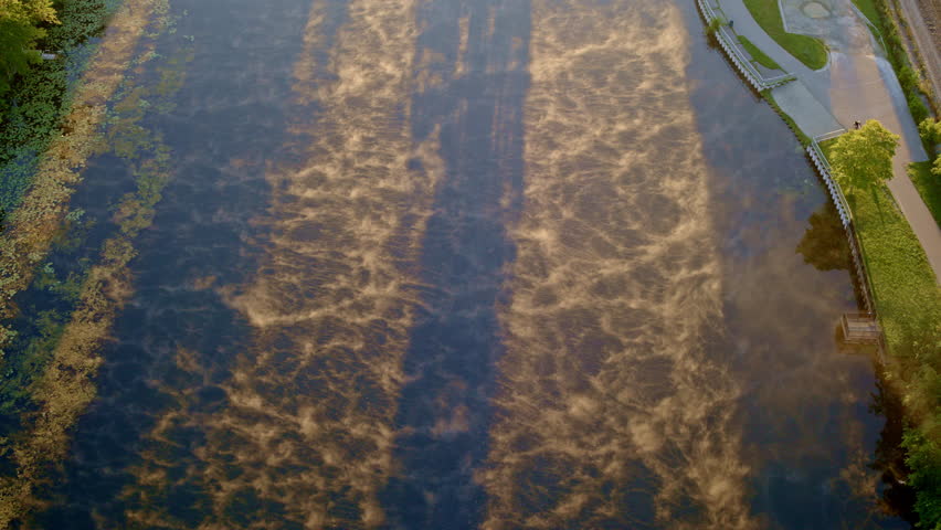 Aerial perspective of a misty and dramatic summer sunrise over the Huron River near Ann Arbor, Michigan.