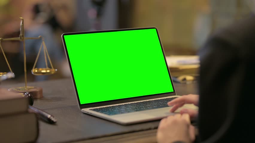 Female Lawyer Working on Laptop with Green Screen