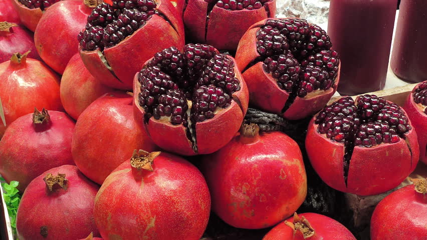 Fresh red pomegranate for juice extraction, Thai street food in Bangkok, Thailand