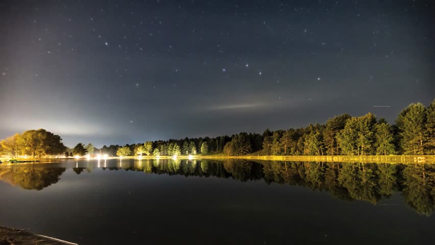 Star Time Lapse Over Forest Pond with Reflections and Mist