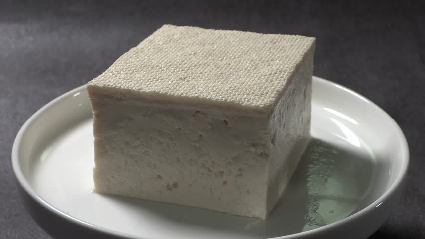 A healthy dish made from soybean. A close-up of Korean tofu made by boiling beans.